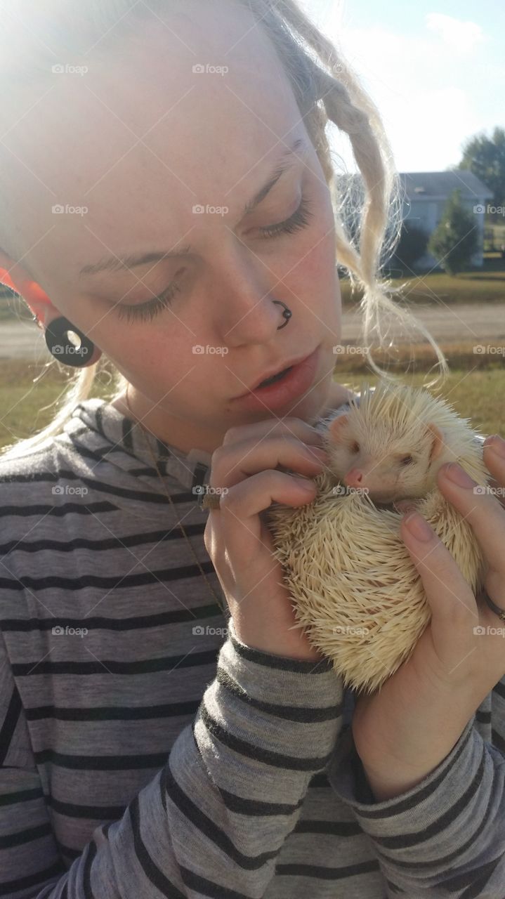 Spiny Pet. this is a picture of my daughter and her hedgehog, Craig