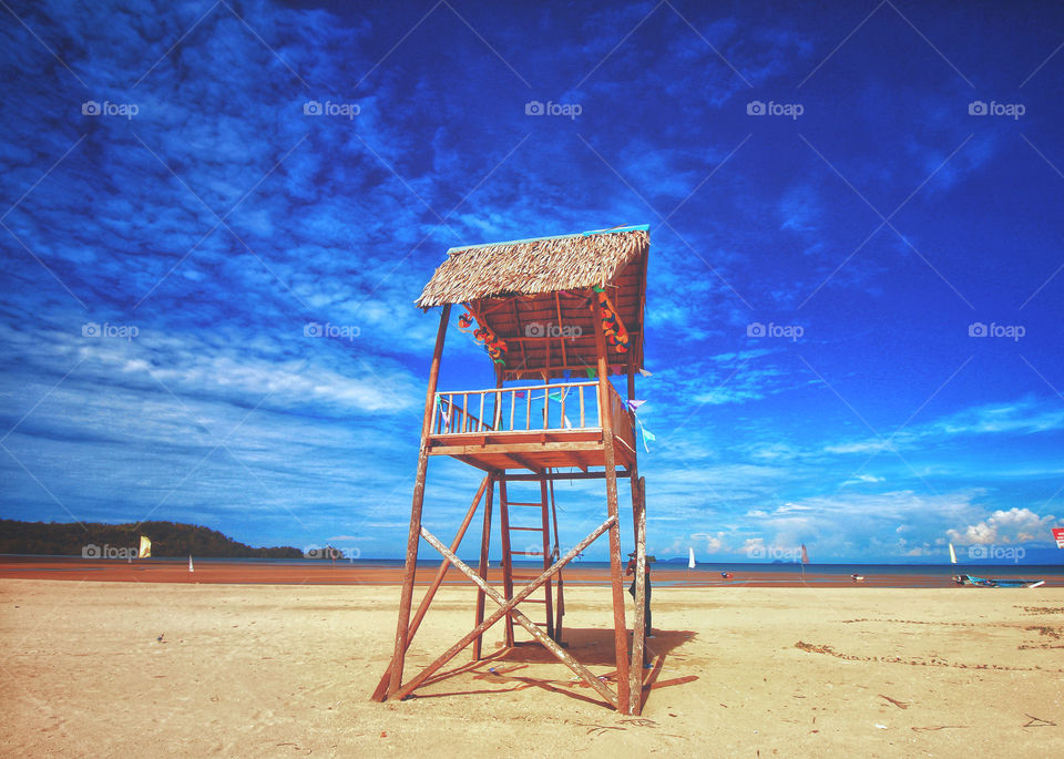 Wooden hut by the beach on a beautiful day