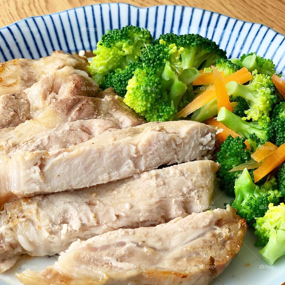 Pork loin steak with broccoli and carrots for lunch or dinner 
