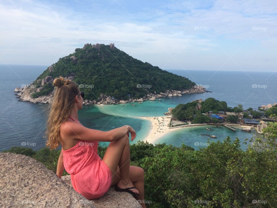 Young woman enjoying beautiful view of islands and beaches from view point