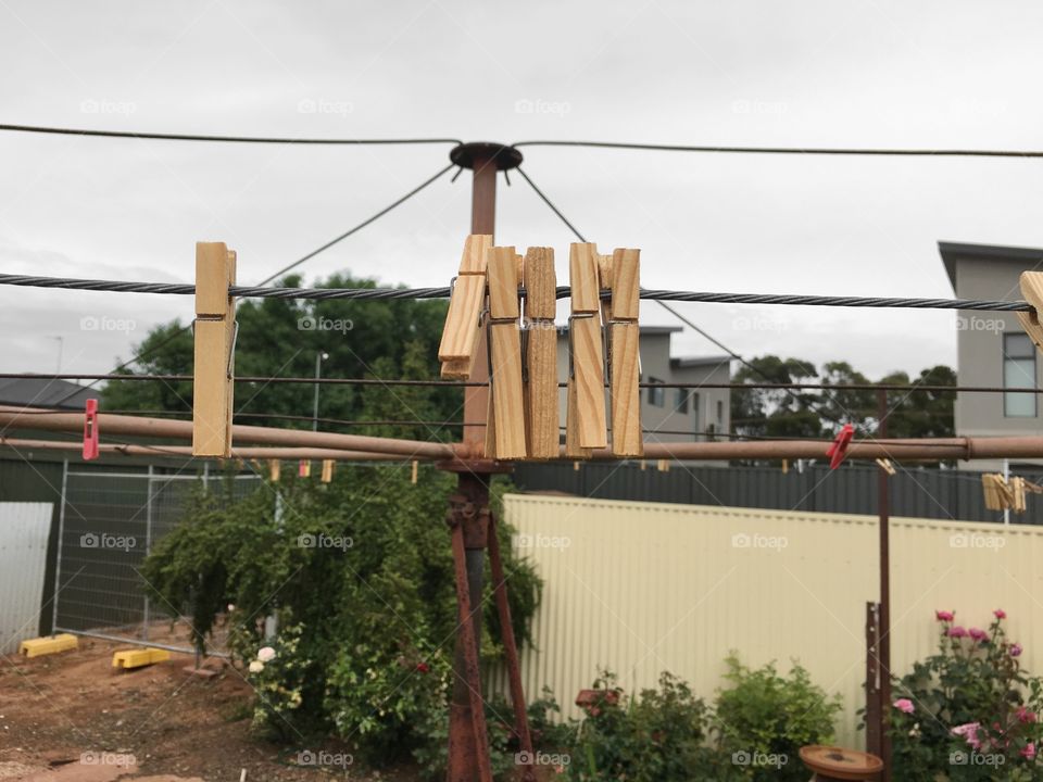 Clothes pegs on a clothesline backyard