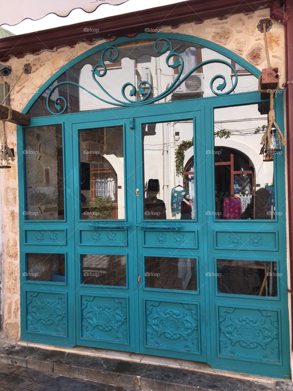 Reflections in Turquoise glass door