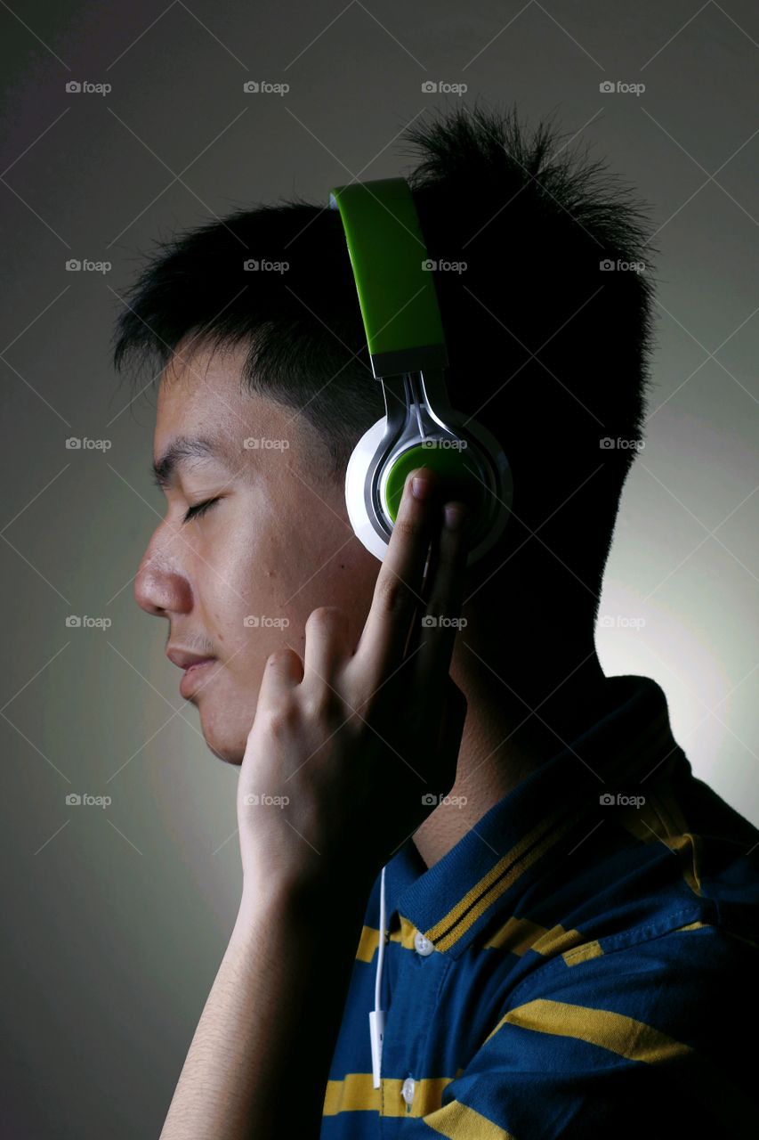 male teenager with headphones