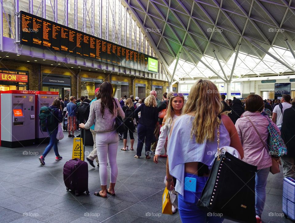 Waiting passengers at Kings Cross Train Station London ...