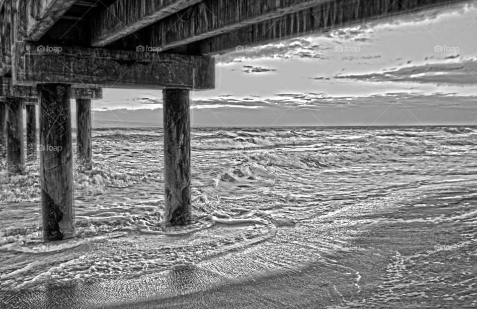 black and white under pier