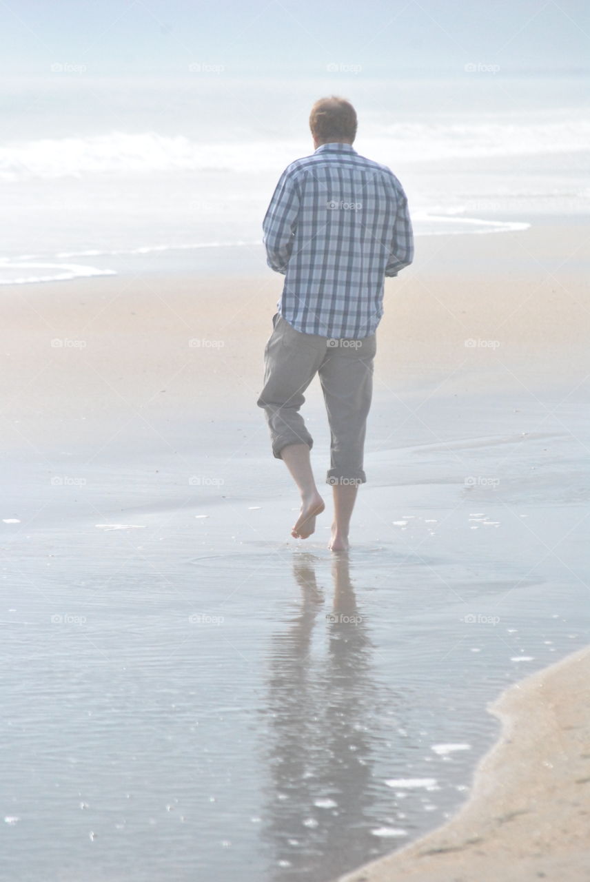 Man Walks on Beach in South Carolina