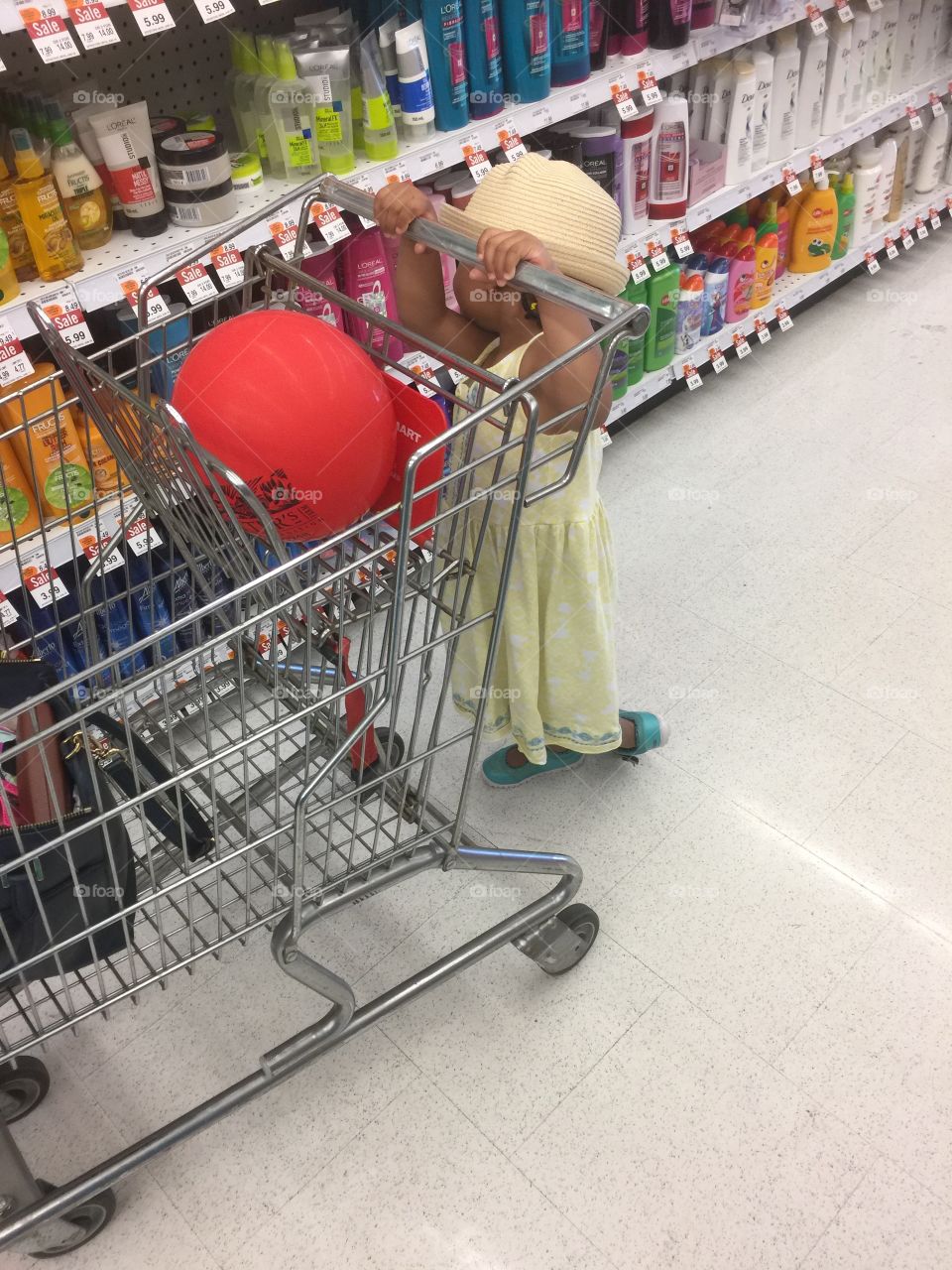 Little girl shopping At shoppers drug Mart