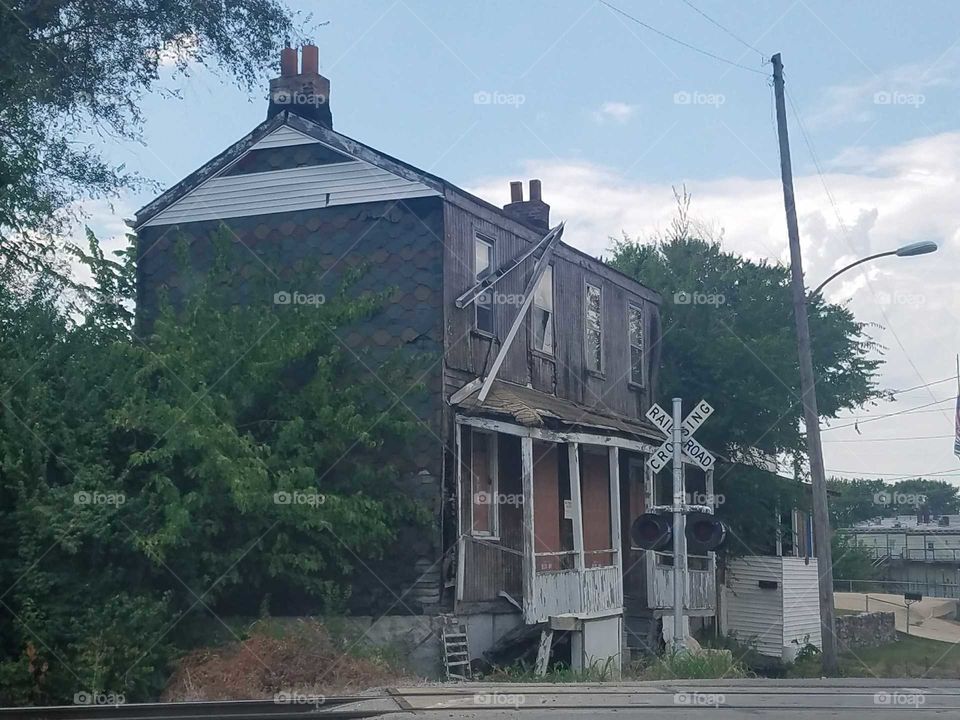 old house by the railroad tracks