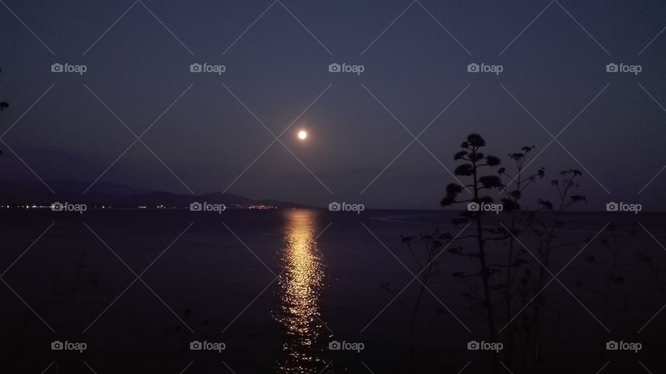 full moon. Terracina, Italy, the moon reflecting itself in the sea