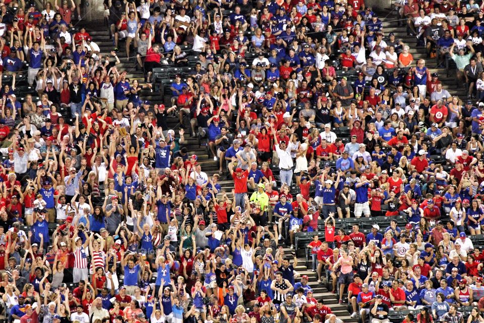 Do the wave. Crowd doing the wave at a Texas Rangers baseball game