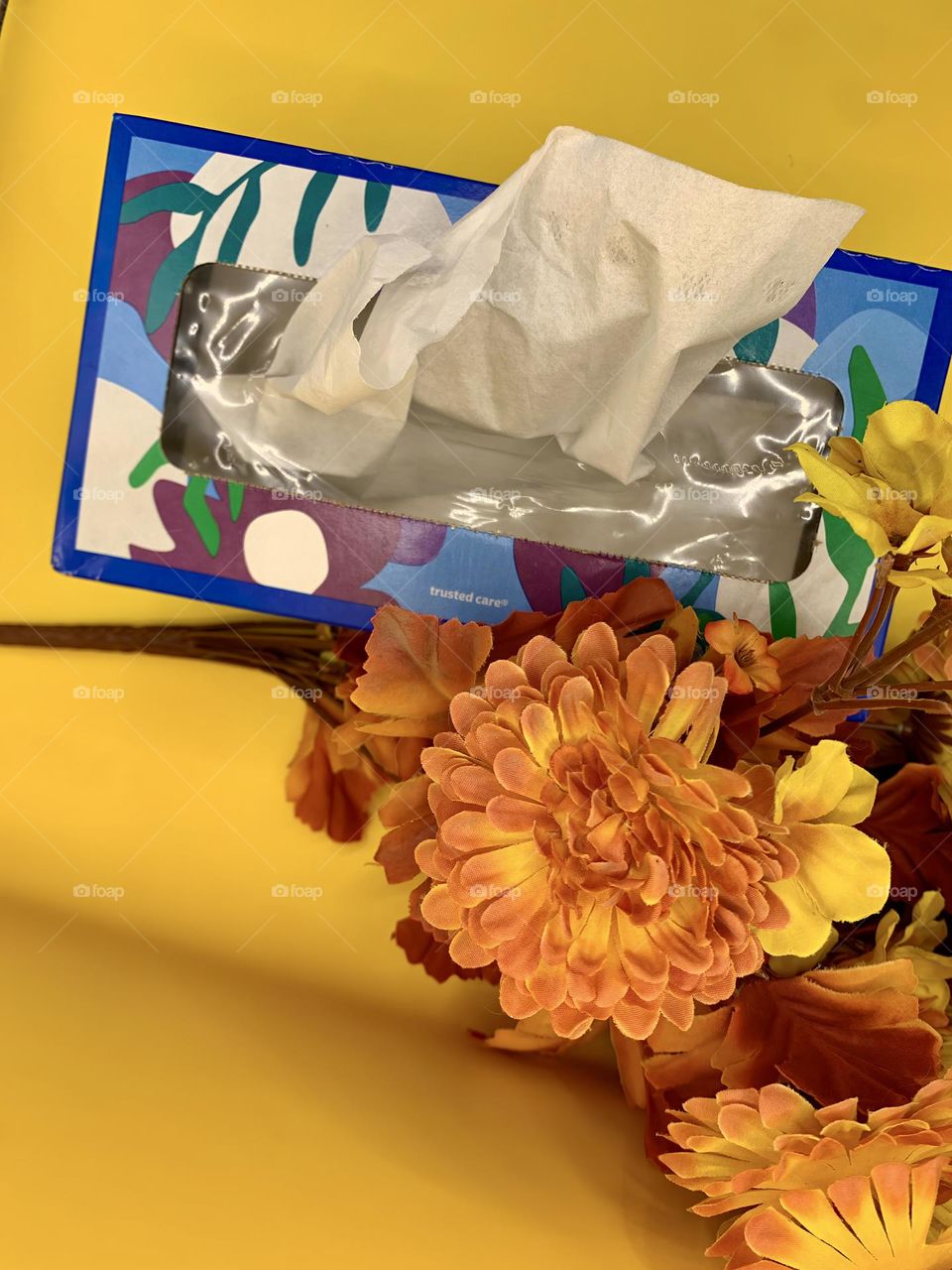 Tissue Box Consolation With An Orange Bouquet Of Fabric Flowers With Yellow Background.