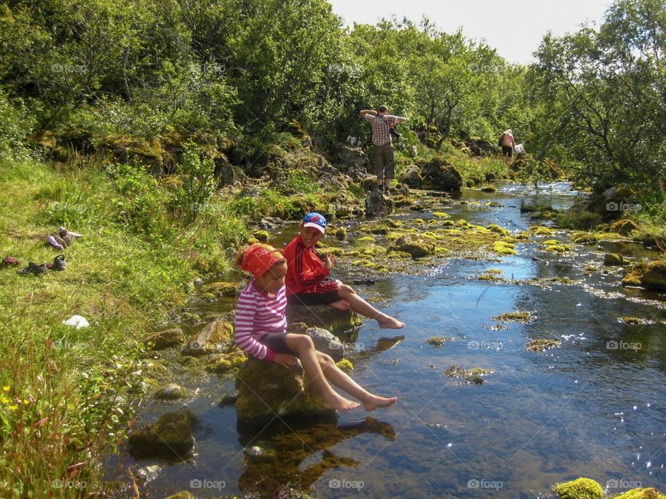 My kids playing in a stream on a hot summers day.   We decided to spend sometime exploring the country side on the Southwestern side of Iceland.  Glad we did. 