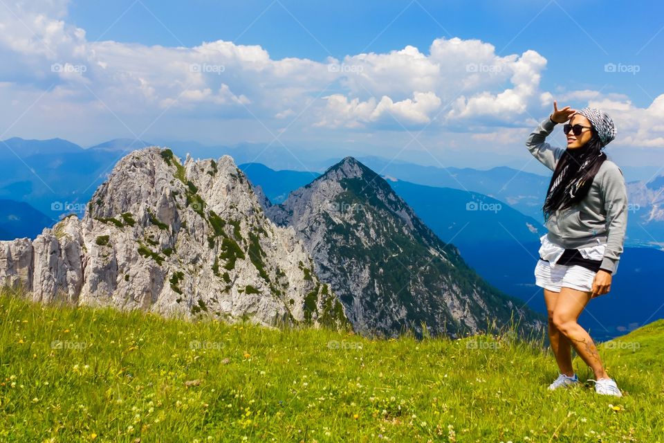 Woman hiker standing at hill