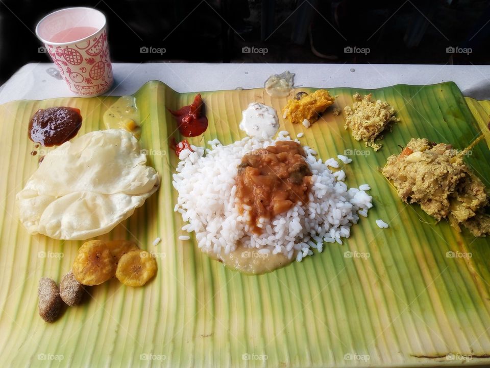 Sadhya (Malayalam: സദ്യ) is a feast of Kerala origin and of importance to all Malayalis, consisting of a variety of traditional vegetarian dishes usually served on a bananaleaf in Kerala, India.