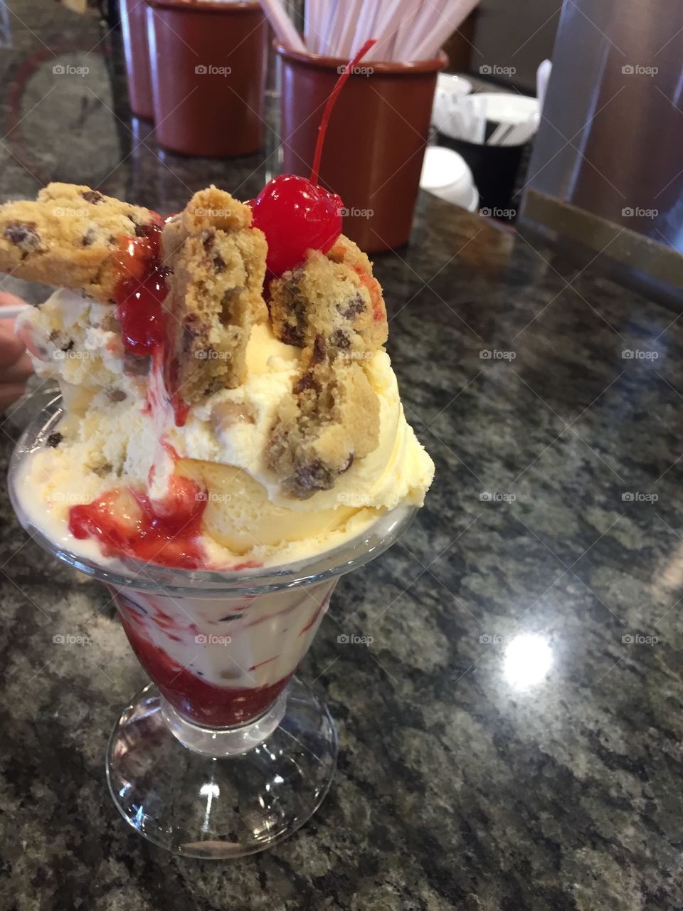 Ice Cream Sundae, Cookie Sundae, Chocolate Chips, Cherry, Raspberry Sauce, Strawberry Sauce, Chocolate chip ice cream, choc. Chip cookies.