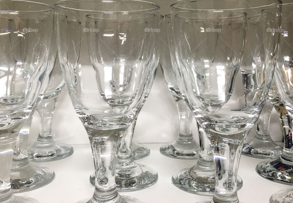 Clear wine glasses stored in cupboard 