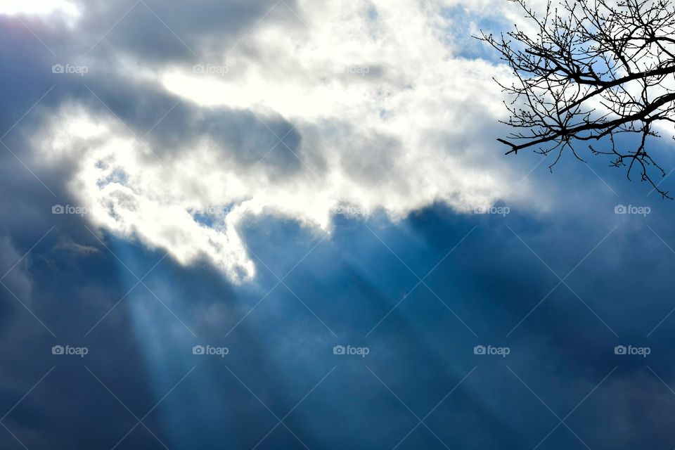 Sunlight streaming through clouds