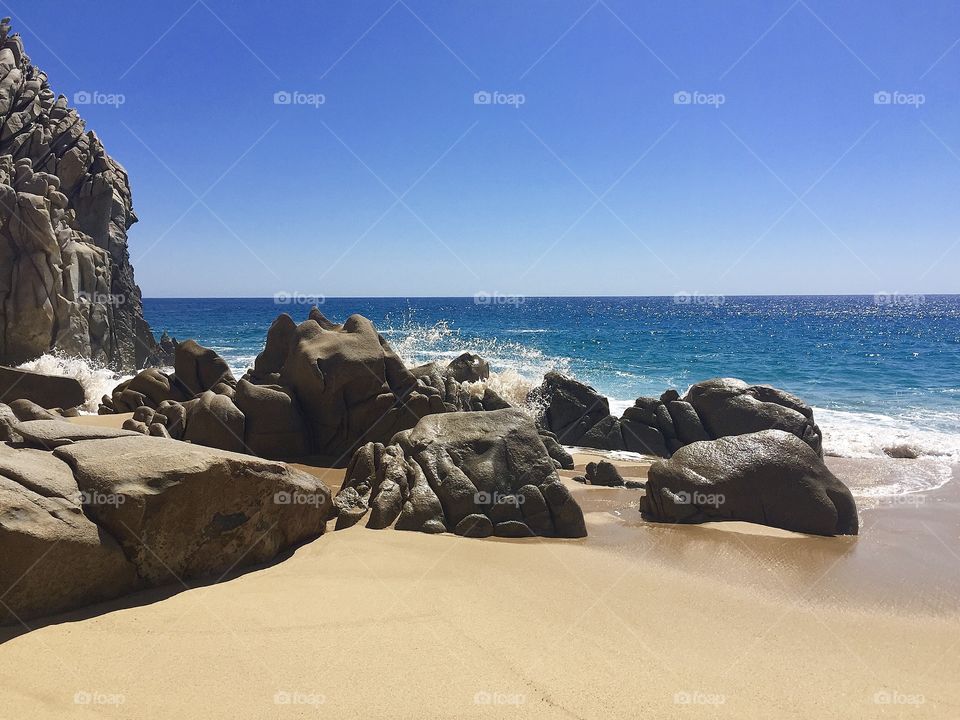 Beautiful sandy beach and rocks in Mexico 