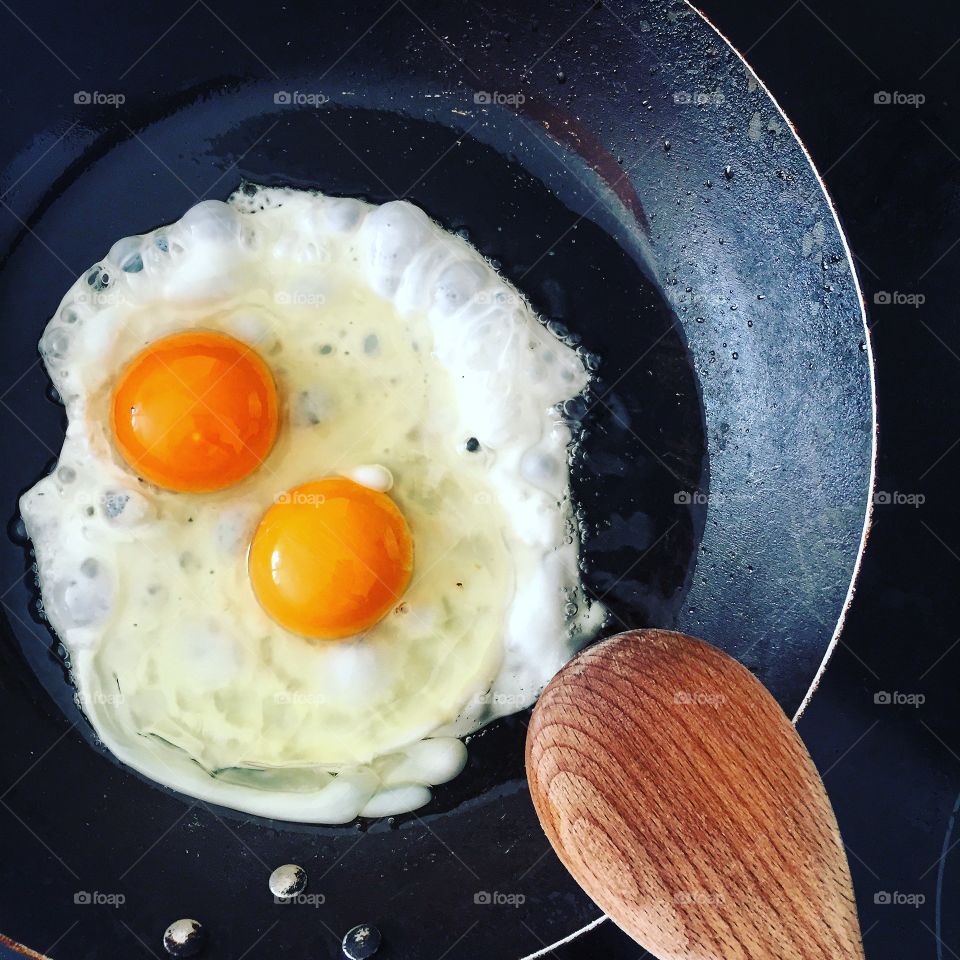 Close-up of eggs frying in pan