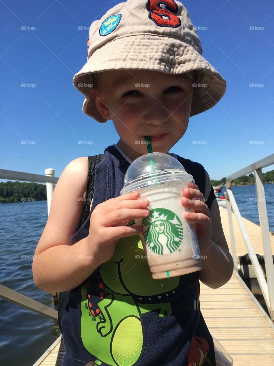 Close-up of a boy drinking milkshake