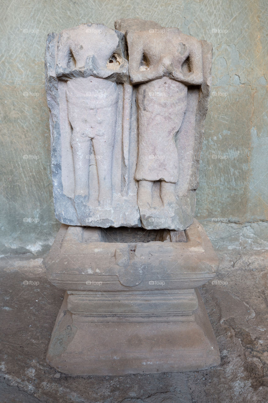 Old broken ruin buddha statue in Ankor Wat in Siem Reap Cambodia 