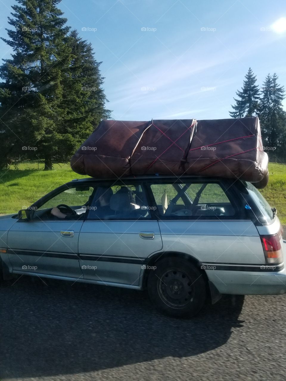 Well, that's one way to do it! Couch tied to roof of station wagon. Creative ways to move furniture. Funny every day Life stuff.