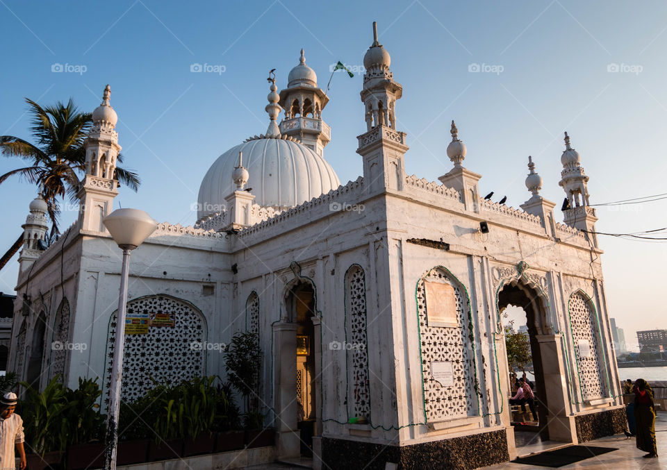 The Haji Ali Dargah is a mosque and dargah (tomb) or the monument of Pir Haji Ali Shah Bukhari located on an islet off the coast of Worli in the southern part of Mumbai.- wiki