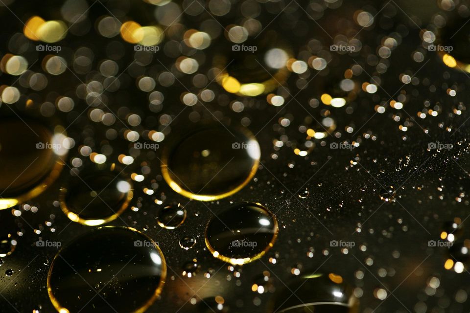 Oil golden bubbles close up background amazing droplets with colours trippy psychedelic minimalist art attack making wonderful view