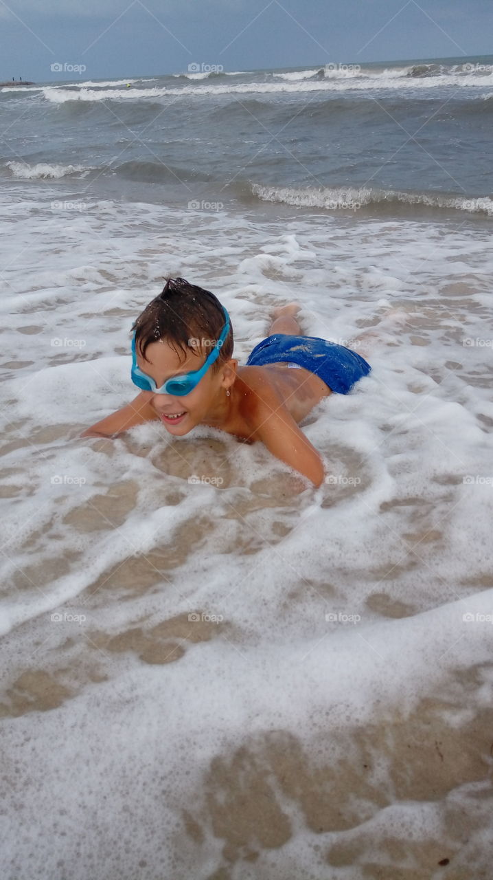 happy boy in the sea