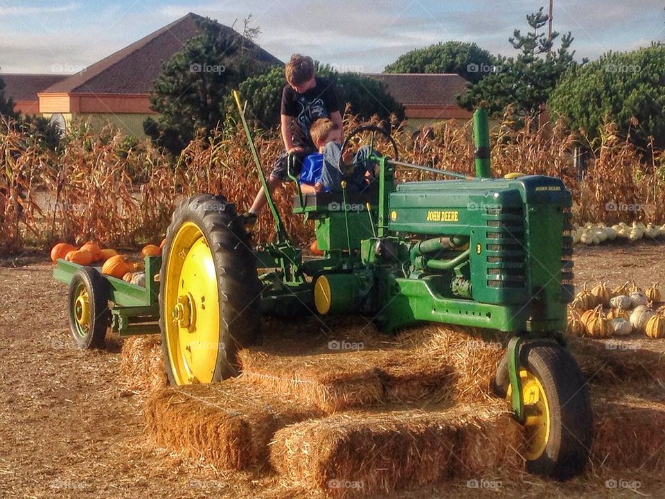 Farm Boys On A Tractor