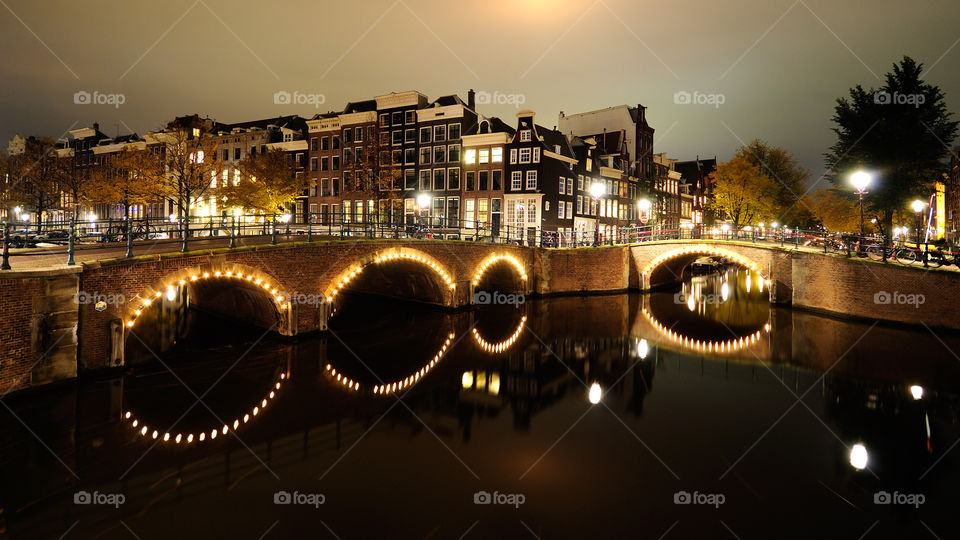 Amsterdam canals by night. One of Amsterdams more famous canal crossings, shot at night