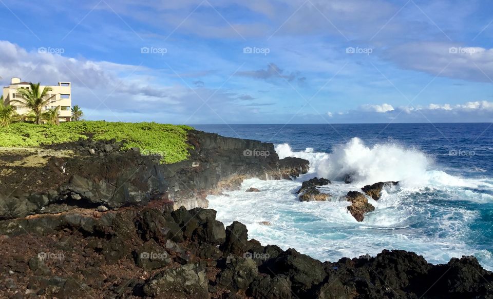 Waves crashing by the sea cliffs