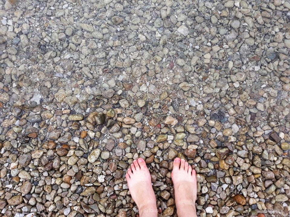 With the feet near to water