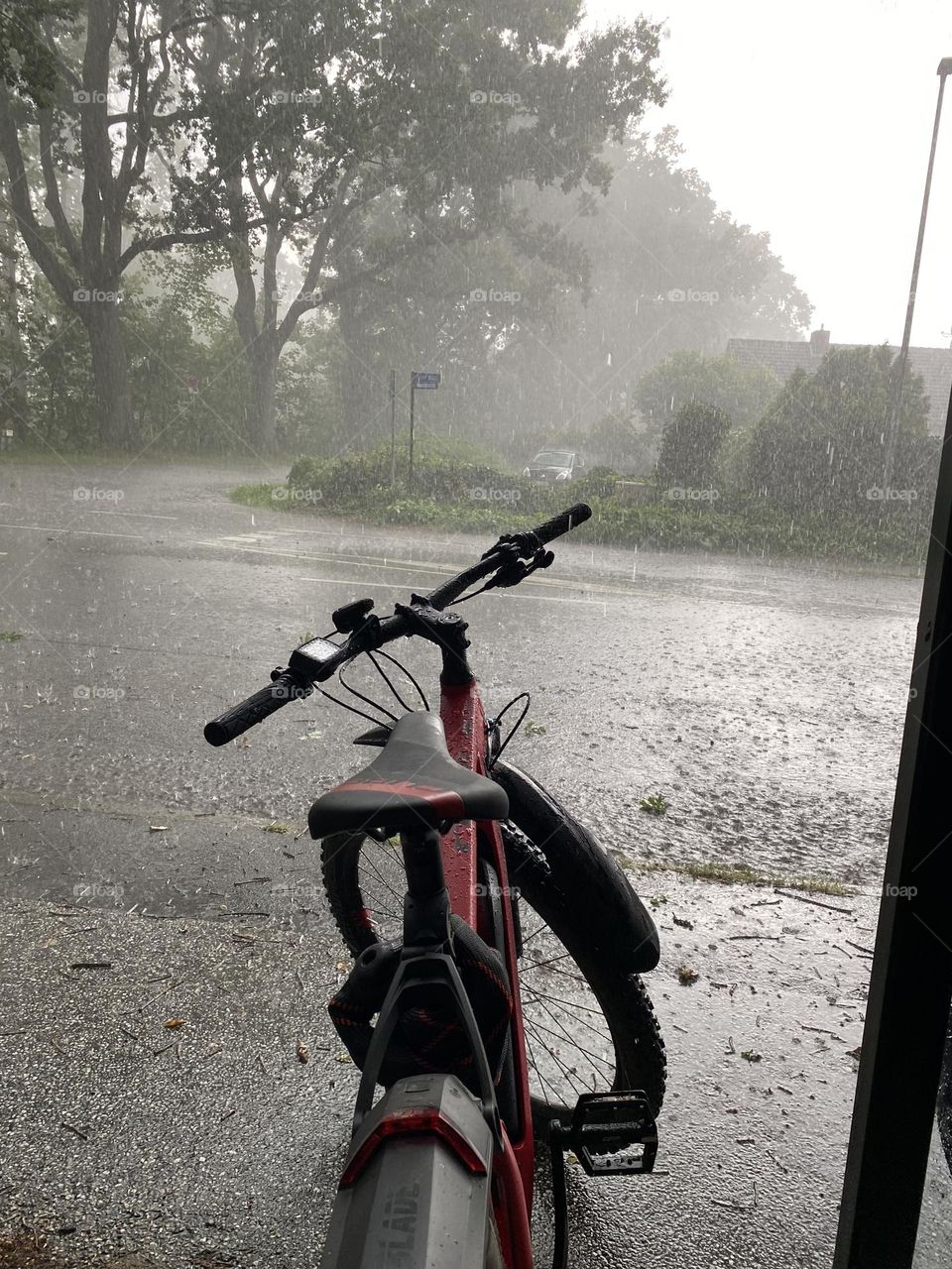 One lonely bicycle in the rain 