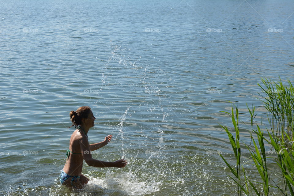 woman in the water lake summer heat, summer vacation