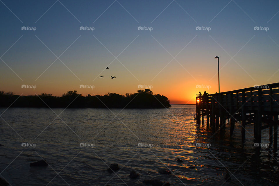 sunset fishing. down in Clearwater Florida. fishing from the peir