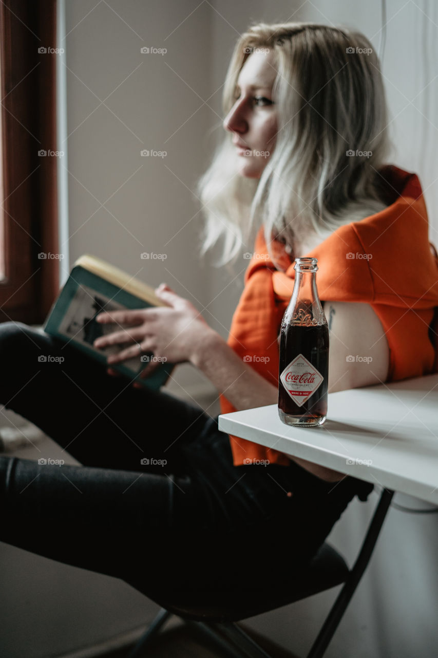 blond girl chilling with coca cola