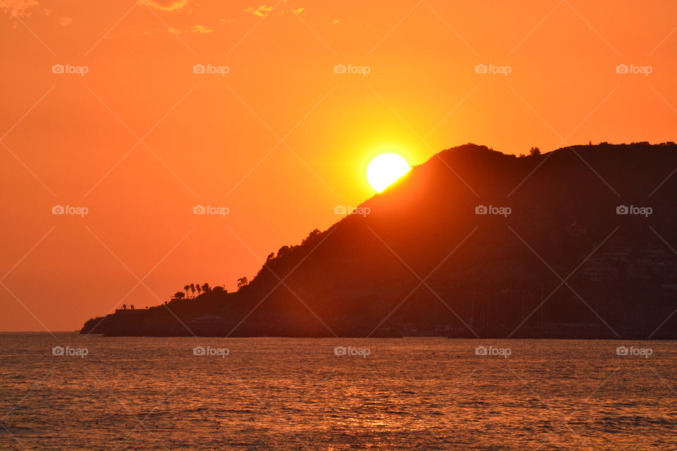 Sunset over mountain and sea