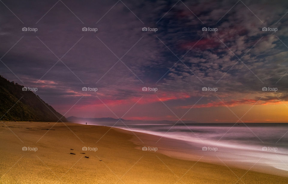 Sunset over Kohaihai beach, West Coast, South Island, New Zealand