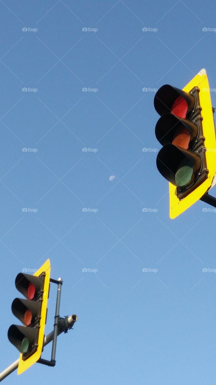 Red light Moon captured in the morning blue sky