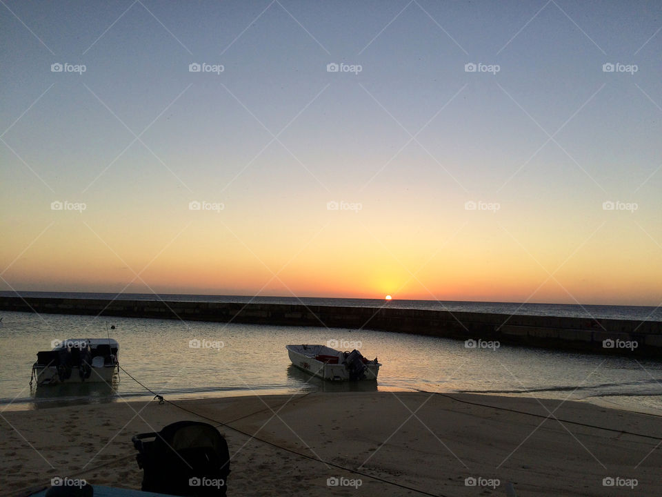 Sunset at the sea with boat