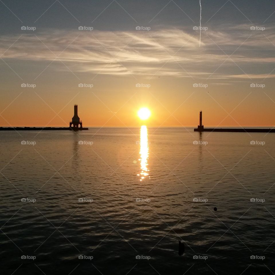 Sunrise on Lake Michigan. This is the Port Washington, Wisconsin harbor on Lake Michigan at sunrise,  my hometown. 