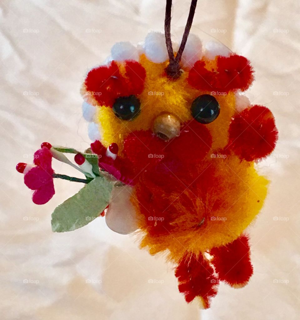 Tiny lion with a flower vase