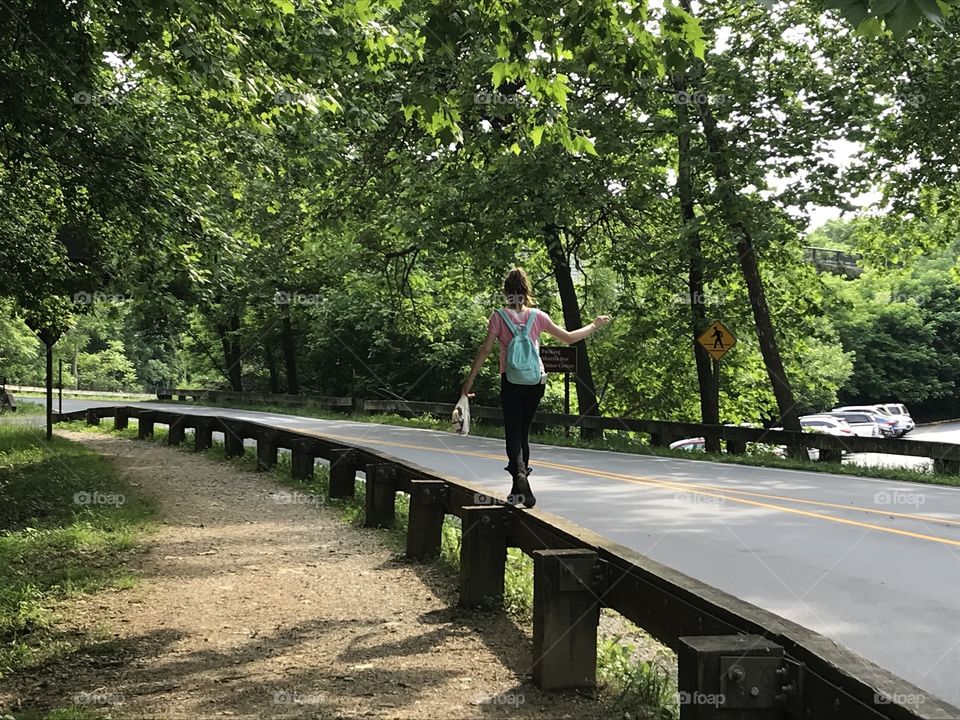 Hiking Harpers Ferry, WV, and as many kids are prone to do, she hopped up on the guardrail like it was a balance beam. 