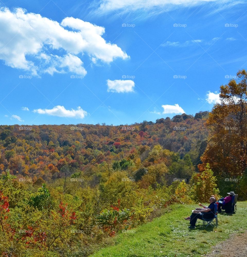 People enjoying Autumn Scenery