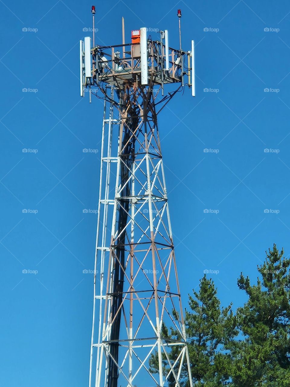 close up view of a short wave  communications tower to signal planes at an airport