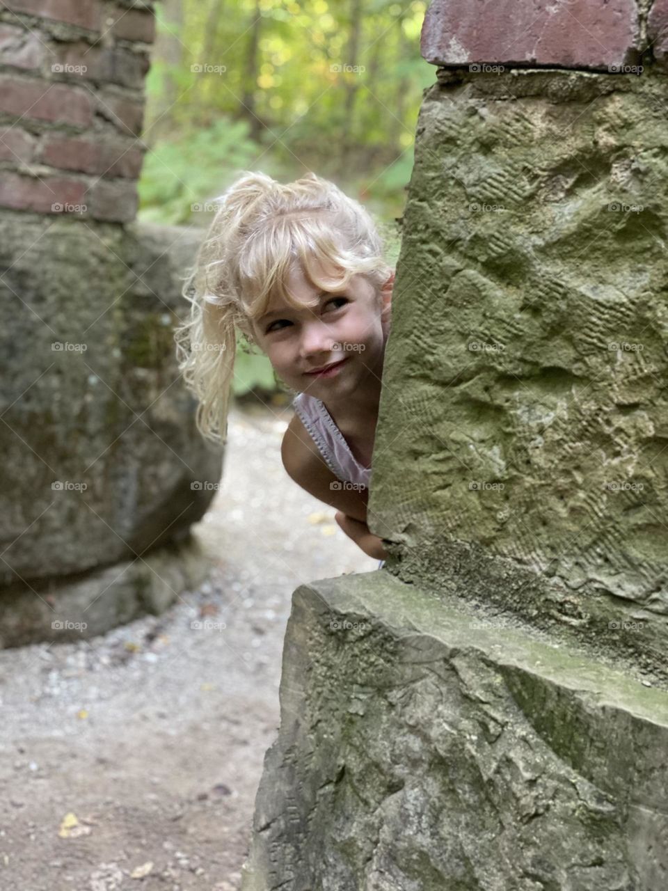 Summer fun exploring old ruins in a park