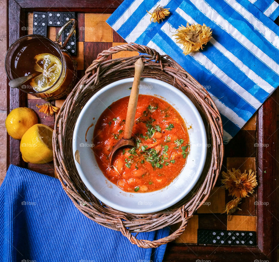Baked broad beans with onions and tomatoes