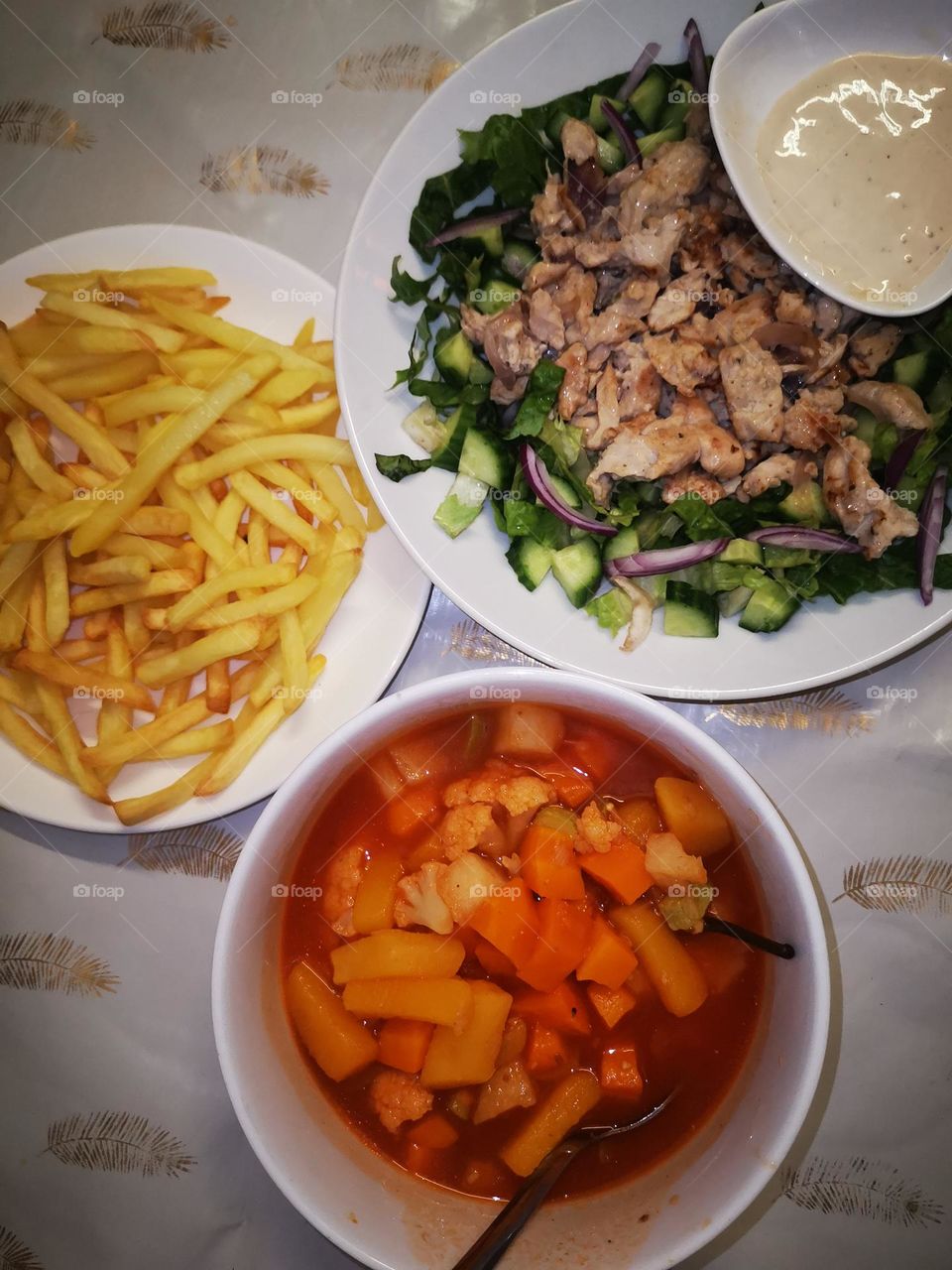 Vegetable lunch with chicken shawarma, salads and potatoes