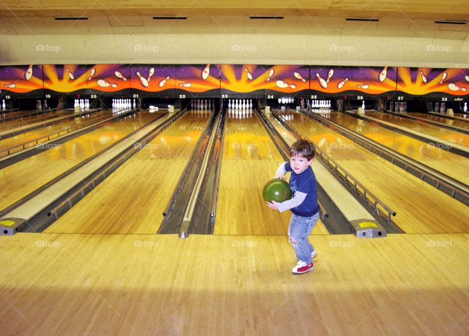 Young Boy In A Bowling Alley